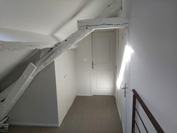 Rénovation d'une chambre avec poutres apparentes à Basse-Goulaine